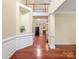 Spacious foyer featuring hardwood floors, high ceilings, display nook, and an open floor plan at 9903 Southampton Commons Dr, Charlotte, NC 28277
