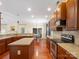 Well-equipped kitchen features stainless appliances, granite countertops, a center island, and modern lighting at 9903 Southampton Commons Dr, Charlotte, NC 28277