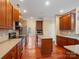 Spacious kitchen with granite countertops, stainless steel appliances, and a center island for meal preparation at 9903 Southampton Commons Dr, Charlotte, NC 28277
