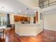Bright kitchen and dining area with hardwood floors, ample cabinet space, and a breakfast bar at 9903 Southampton Commons Dr, Charlotte, NC 28277
