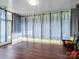 Cozy sunroom with ample natural light, curtained windows, and views of the outdoors at 9903 Southampton Commons Dr, Charlotte, NC 28277