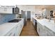 Clean kitchen design with white cabinets and farmhouse sink at 1014 Merganser Way, Indian Trail, NC 28079