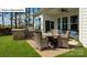 Outdoor patio with built-in grill and seating area for dining at 1014 Merganser Way, Indian Trail, NC 28079