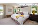 Main bedroom with a tufted headboard and large window at 2023 Canvasback Way, Indian Trail, NC 28079