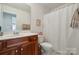 Clean bathroom with a shower/tub combo and wood vanity at 1102 High Brook Dr, Waxhaw, NC 28173