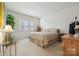 Bright bedroom with carpet, neutral walls, natural light, and decorative furniture at 1102 High Brook Dr, Waxhaw, NC 28173