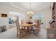 Traditional dining room with an oval table, six chairs, and a chandelier at 1102 High Brook Dr, Waxhaw, NC 28173