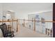 Upstairs hallway with high ceilings and views to downstairs living area at 1102 High Brook Dr, Waxhaw, NC 28173