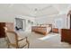 Spacious main bedroom suite with tray ceilings, carpet and neutral walls, and furniture at 1102 High Brook Dr, Waxhaw, NC 28173