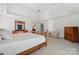 Large, bright main bedroom with carpet, neutral walls, decorative furniture, and a ceiling fan at 1102 High Brook Dr, Waxhaw, NC 28173