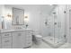 Modern bathroom featuring glass shower with a bench and a white vanity at 124 Saylors Watch Ln, Mooresville, NC 28117