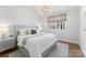 Bedroom with large windows and a light gray color palette with hardwood floors at 124 Saylors Watch Ln, Mooresville, NC 28117