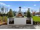 Outdoor pizza oven made of white brick with wood storage, perfect for entertaining in the backyard at 124 Saylors Watch Ln, Mooresville, NC 28117