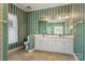 Bathroom with double vanity and green striped wallpaper at 1357 Meadowdale Rd, Rock Hill, SC 29732