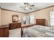 Well-lit bedroom featuring a wooden bed and dresser at 1357 Meadowdale Rd, Rock Hill, SC 29732