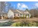 House's side view, showcasing the yard and trees at 1357 Meadowdale Rd, Rock Hill, SC 29732