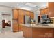 Kitchen with island, stainless steel appliances, and wood cabinets at 1357 Meadowdale Rd, Rock Hill, SC 29732