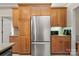 Kitchen with stainless steel refrigerator and wood cabinets at 1357 Meadowdale Rd, Rock Hill, SC 29732