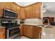 Kitchen with stainless steel appliances and wood cabinets at 1357 Meadowdale Rd, Rock Hill, SC 29732