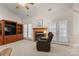 Relaxing living room featuring a fireplace, built-in shelving, and access to a patio at 1357 Meadowdale Rd, Rock Hill, SC 29732