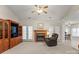 Bright living room with a fireplace, built-in shelving and access to the kitchen and dining areas at 1357 Meadowdale Rd, Rock Hill, SC 29732