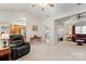 Open living room with a view of the kitchen and entryway. Features a comfortable recliner at 1357 Meadowdale Rd, Rock Hill, SC 29732