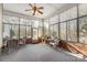 Bright sunroom with ample seating and window blinds at 1357 Meadowdale Rd, Rock Hill, SC 29732