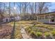 Landscaped backyard with shed and stone pathway at 1511 Longbrook Dr, Charlotte, NC 28270