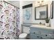 Clean bathroom with gray vanity and shower/tub combo at 1511 Longbrook Dr, Charlotte, NC 28270