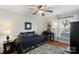 Cozy bedroom with a daybed, built-in workspace, and ceiling fan at 1511 Longbrook Dr, Charlotte, NC 28270