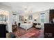 Main bedroom with ensuite bathroom and sitting area at 1511 Longbrook Dr, Charlotte, NC 28270