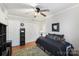 Well-lit bedroom with double closet and ceiling fan at 1511 Longbrook Dr, Charlotte, NC 28270