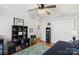 Spacious bedroom with built-in shelving and ceiling fan at 1511 Longbrook Dr, Charlotte, NC 28270