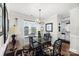 Bright dining room with hardwood floors and a window seat at 1511 Longbrook Dr, Charlotte, NC 28270