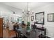 Formal dining room with hardwood floors and a chandelier at 1511 Longbrook Dr, Charlotte, NC 28270