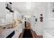 Kitchen with white cabinets, stainless steel appliances, and tile backsplash at 1511 Longbrook Dr, Charlotte, NC 28270