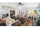 Bright living room with hardwood floors, a fireplace, and ample natural light at 1511 Longbrook Dr, Charlotte, NC 28270