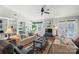 Living room with hardwood floors, built-in shelving, and a fireplace at 1511 Longbrook Dr, Charlotte, NC 28270