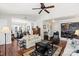 Spacious living room with hardwood floors, vaulted ceilings, and built-in shelving at 1511 Longbrook Dr, Charlotte, NC 28270