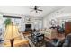 Living room with hardwood floors, fireplace and access to back patio at 1511 Longbrook Dr, Charlotte, NC 28270