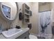 Clean bathroom with a pedestal sink and shower at 247 Camp Rotary Rd, Gastonia, NC 28052