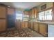 Kitchen with wood cabinets, tile floor and appliances at 247 Camp Rotary Rd, Gastonia, NC 28052