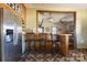 Kitchen with island and bar stools, open to living area at 247 Camp Rotary Rd, Gastonia, NC 28052