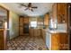 Kitchen with wood cabinets, tile floor and appliances at 247 Camp Rotary Rd, Gastonia, NC 28052