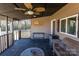 Relaxing screened porch with ceiling fan and seating at 247 Camp Rotary Rd, Gastonia, NC 28052