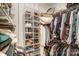 Organized closet with hanging racks, storage bins, and plenty of space for clothing and accessories at 300 W 5Th St # 339, Charlotte, NC 28202