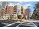 Beautiful multi-story building featuring balconies, brick accents, and manicured landscaping at 300 W 5Th St # 339, Charlotte, NC 28202