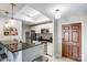 Kitchen with breakfast bar, stainless steel appliances, white cabinetry, and tiled backsplash at 300 W 5Th St # 339, Charlotte, NC 28202