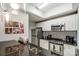 Kitchen area featuring stainless appliances, granite countertops, and white cabinetry at 300 W 5Th St # 339, Charlotte, NC 28202