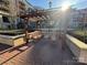 Exterior community patio with wood pergola and benches at 300 W 5Th St # 339, Charlotte, NC 28202